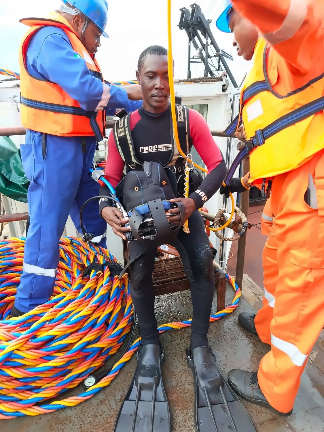 Dive Marine dive team preparing a commercial diver before an inspection dive